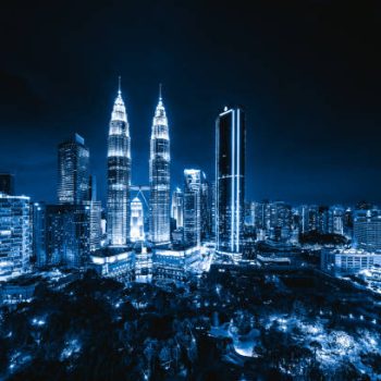Aerial view of Kuala Lumpur Downtown, Malaysia. Financial district and business centers in smart urban city in Asia. Skyscraper and high-rise buildings at night.